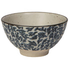 Ceramic bowl with blue leaf pattern on a white background