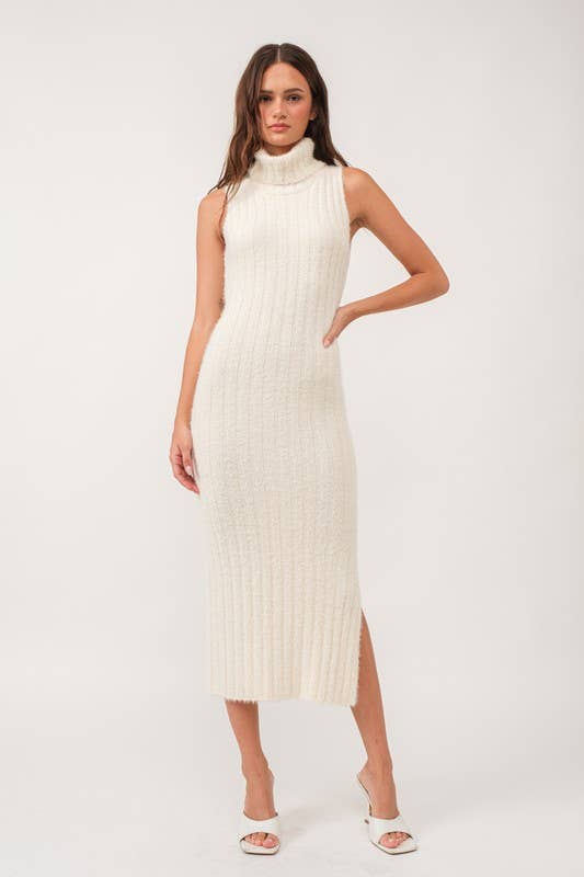 Woman wearing a sleeveless white turtle neck rib-knit midi dress.