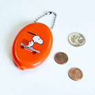 Peanuts Snoopy Skateboard Coin Pouch - Snoopy on a skateboard, a playful and compact coin pouch for Peanuts enthusiasts.