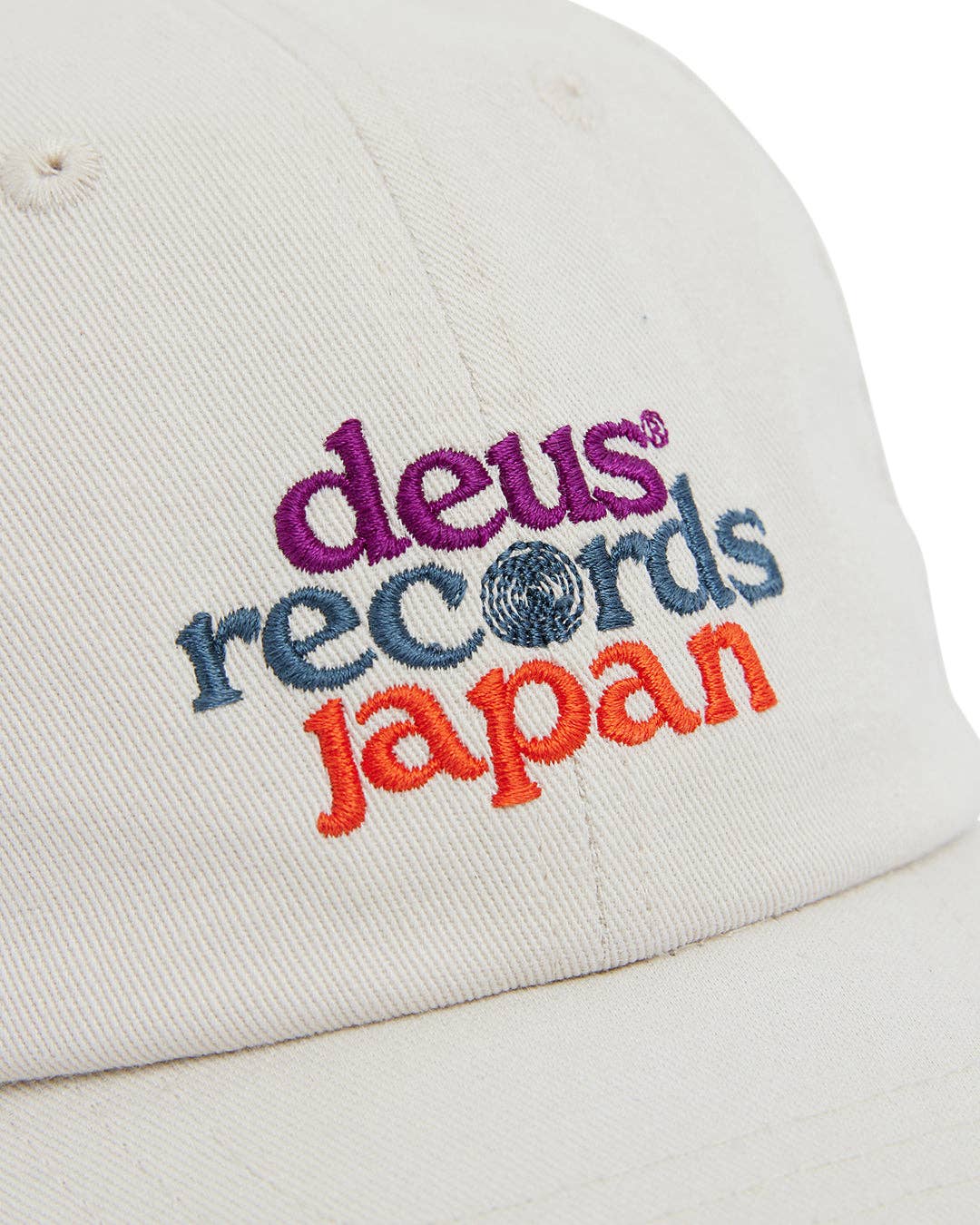 White cap with colorful embroidered text on a white background
