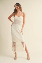 Model wearing the Maren Knitted Dress with delicate straps, mesh waist detail, and open-stitch hem.