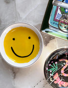 Smiley Trinket Dish: A cheerful trinket dish with smiley face design, epitome of positivity and happiness.