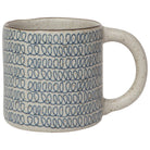 Handmade ceramic mug with a speckled glaze and blue loop pattern, featuring a sturdy handle for coffee or tea.