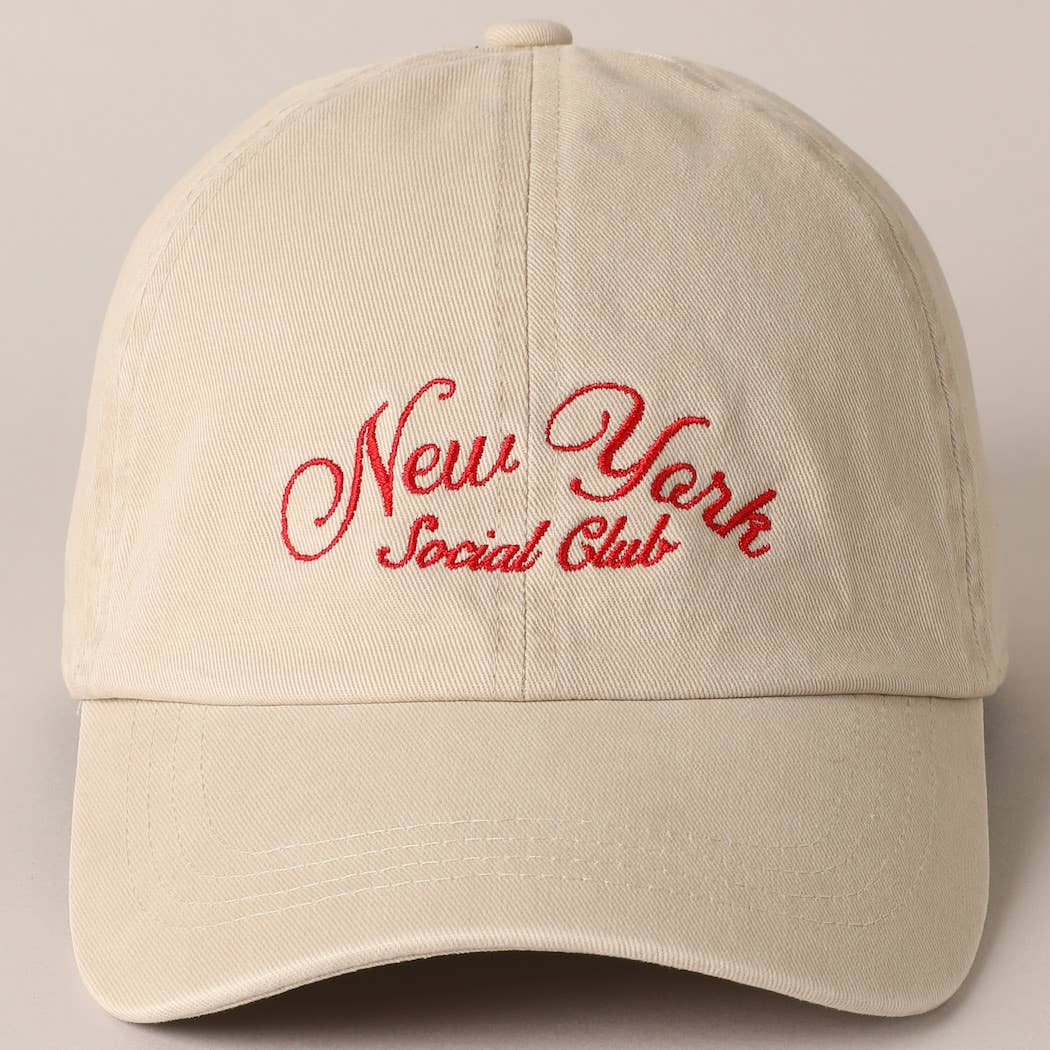Beige and navy New York Social Club embroidered baseball caps with curved brims.