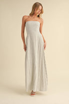 Back-tie strapless striped maxi dress with full-length skirt and bow detail