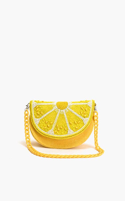 Yellow lemon slice-shaped bag with beaded detailing and a matching twisted rope shoulder strap.