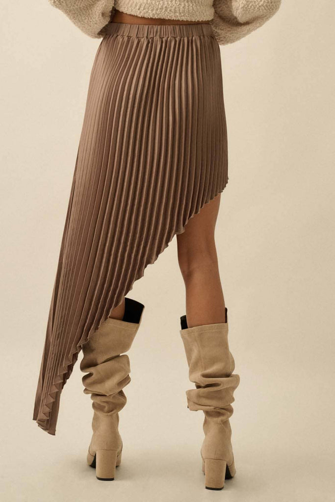 Brown asymmetric pleated skirt with flowing high-low hem.