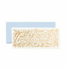 A congratulations card with intricate gold floral designs and a light blue envelope.