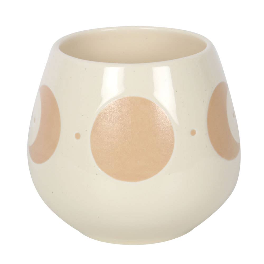 Ivory mug with moon phase design and cork coaster.
