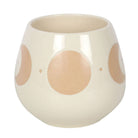 Ivory mug with moon phase design and cork coaster.