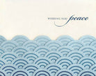Text 'Wishing you peace' with a blue wave pattern on a beige background