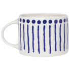 White mug with blue pattern on a white background