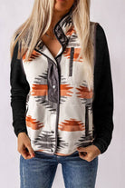 Model wearing an Aztec Western Fleece Vest Jacket with a bold pattern, snap-button front, and zippered pockets.