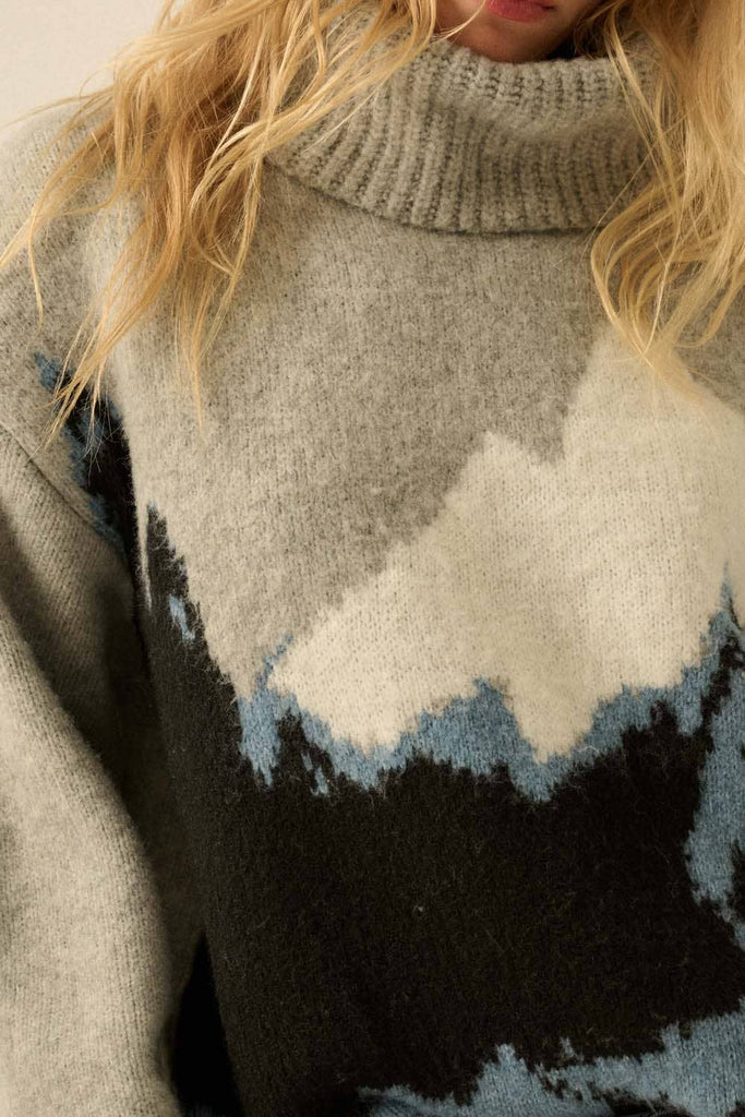 Close-up of a sweater with a mountain design