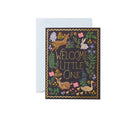 "Welcome Little One" baby greeting card with gold lettering, woodland animals, and floral details, paired with a pastel envelope.