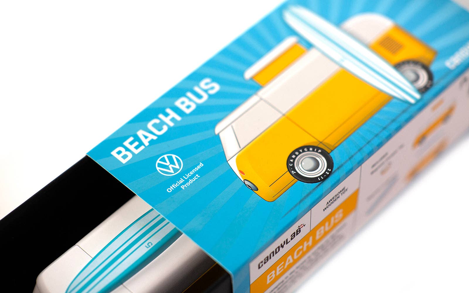 Volkswagen Beach Bus toy packaging with blue and yellow design.