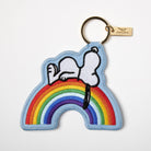 Embroidered Snoopy keychain with Snoopy lying on a colorful rainbow.