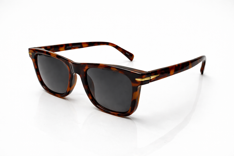 Sunglasses with tortoiseshell frame and dark lenses on a white background
