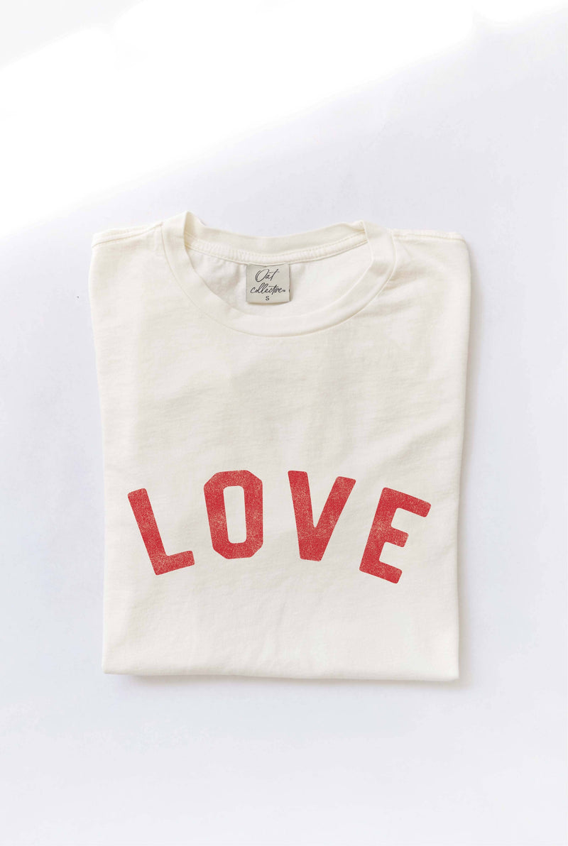 Ivory "LOVE" graphic t-shirt with bold red vintage-style lettering, made from soft cotton for a relaxed and comfortable fit.