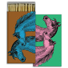 Matchbox with artistic horse illustrations in blue, brown, pink, and green color contrasts.
