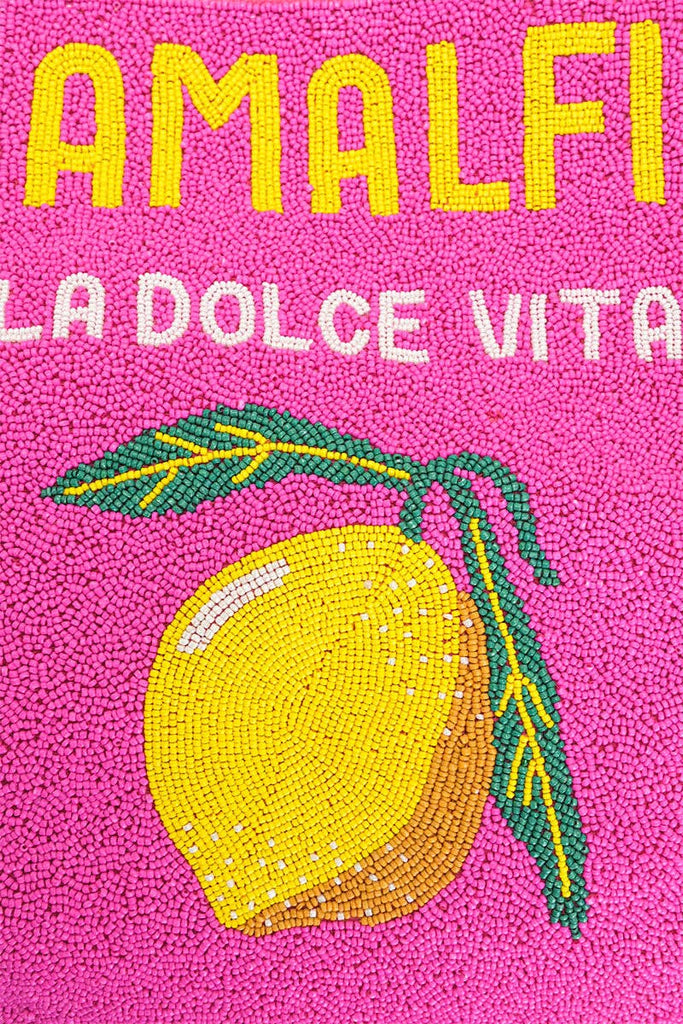 Colorful beaded tote bag with "Amalfi La Dolce Vita" text, lemon motif, and yellow-pink fabric with green handles.