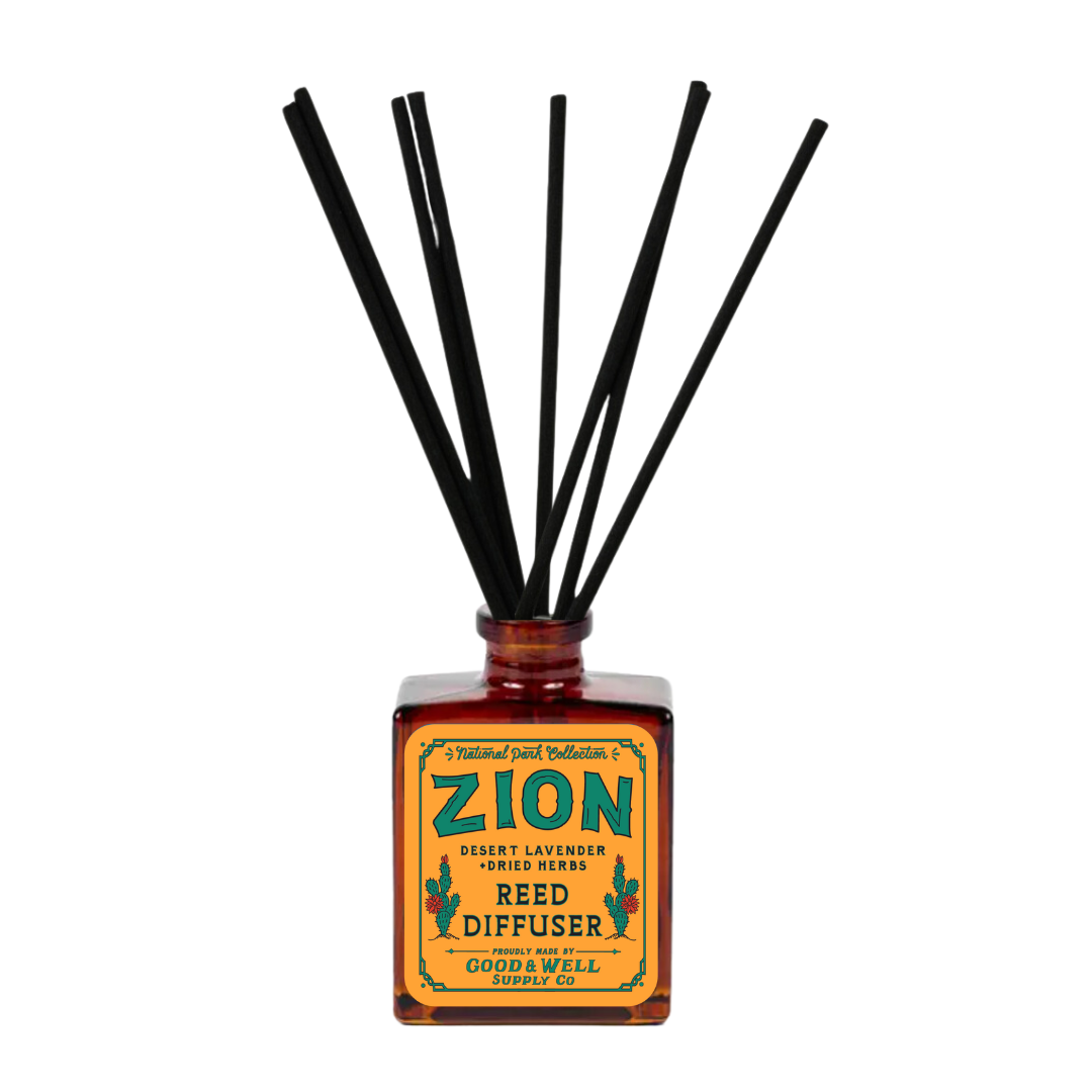 Zion reed diffuser with amber glass bottle and black reeds by Good & Well Supply Co., scented with desert lavender and herbs.