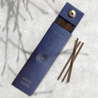 Elegant blue box of natural incense sticks with embossed detailing and a built-in holder, perfect for relaxation and mindfulness.