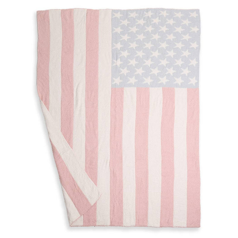 Pink and white striped blanket with star pattern on a white background