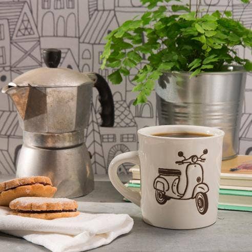 White ceramic mug with a black sketch of a vintage moped.