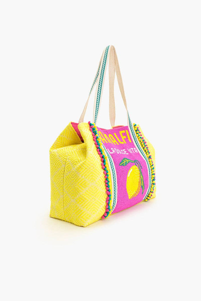 Colorful beaded tote bag with "Amalfi La Dolce Vita" text, lemon motif, and yellow-pink fabric with green handles.