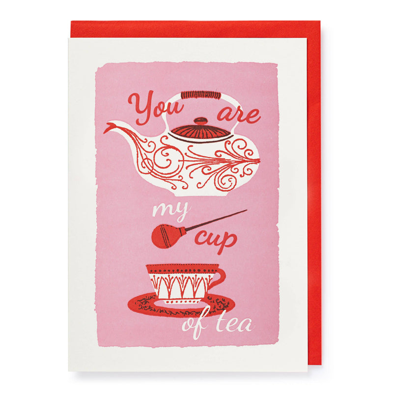 A greeting card featuring a steaming cup of tea.