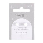 Howlite crystal stud earrings on a matching backing card held by a hand with black nail polish.