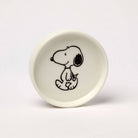 Round ceramic trinket dish with a black-and-white illustration of a walking beagle, packaged in a red and yellow gift box.