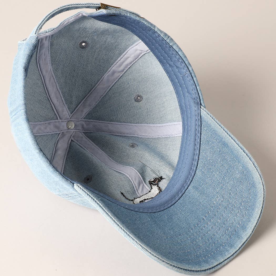 Blue denim cap on a beige background