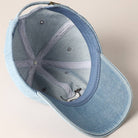 Blue denim cap on a beige background