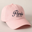 Pink cap with 'Paris Social Club' text on a light gray background