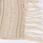Woman wearing a Seaside Serenity Crochet Cover-Up Dress with a crochet design, adjustable spaghetti straps, and a fringe hem.