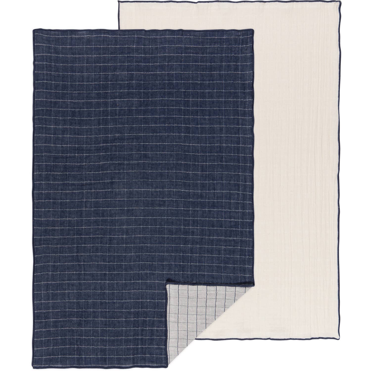 Two dishtowels, one with a midnight blue grid pattern on a light background and another with a solid light beige color, both laid out flat.