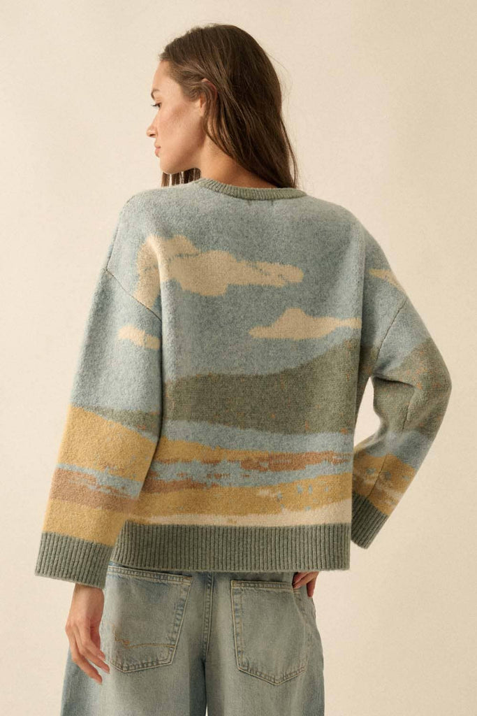 Woman wearing a sweater with cloud pattern on a beige background