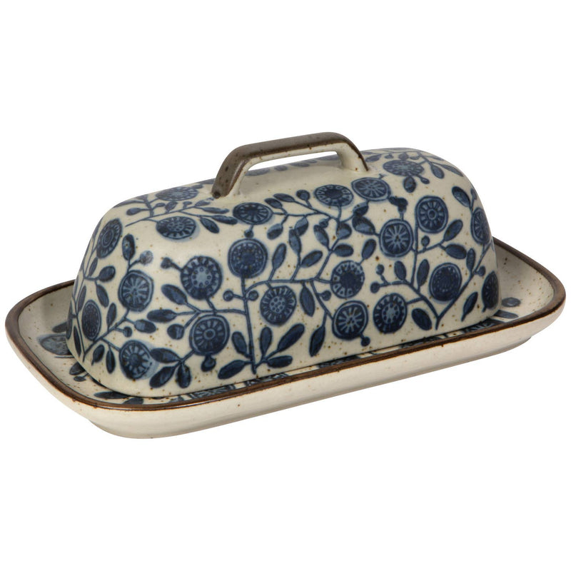 Ceramic butter dish with blue floral pattern on a white background