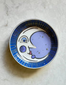Moon trinket dish with a whimsical moon design in blue and purple accents, perfect for holding small items.