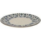 Ceramic plate with blue floral pattern on a white background