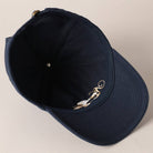 Beige and navy New York Social Club embroidered baseball caps with curved brims.