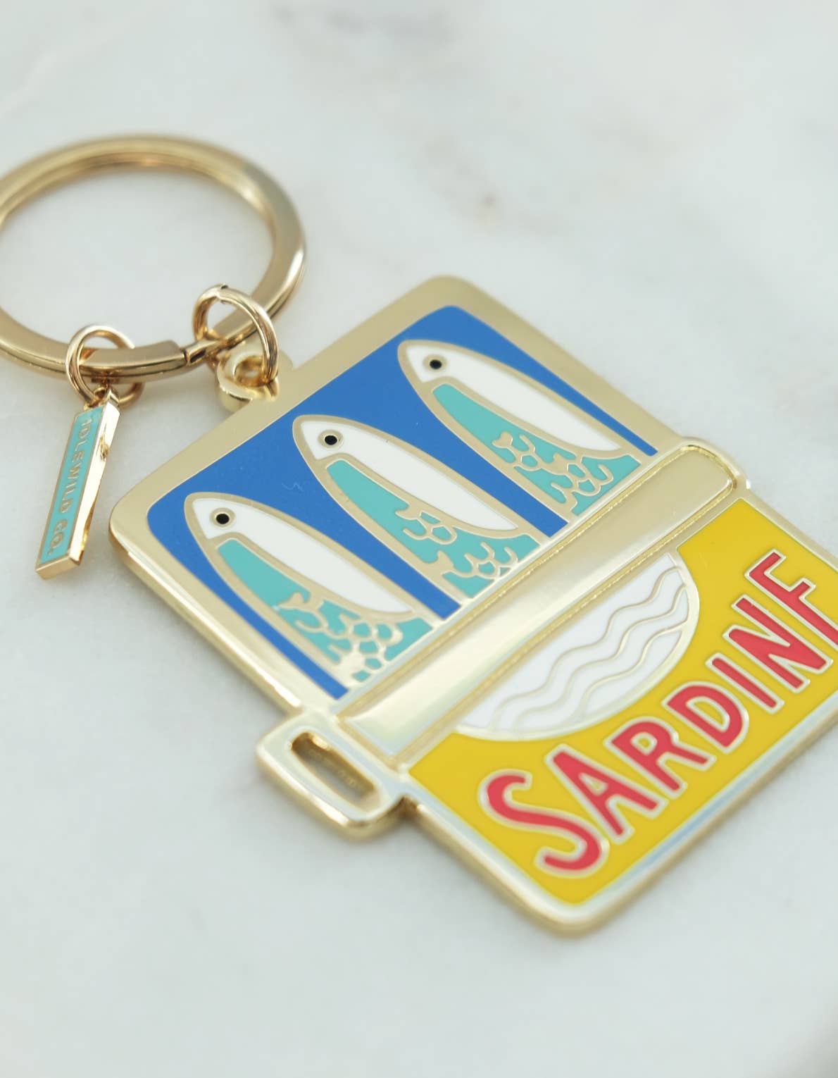 Keychain with sardine design on a white background