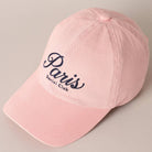 Pink cap with 'Paris Social Club' text on a beige background