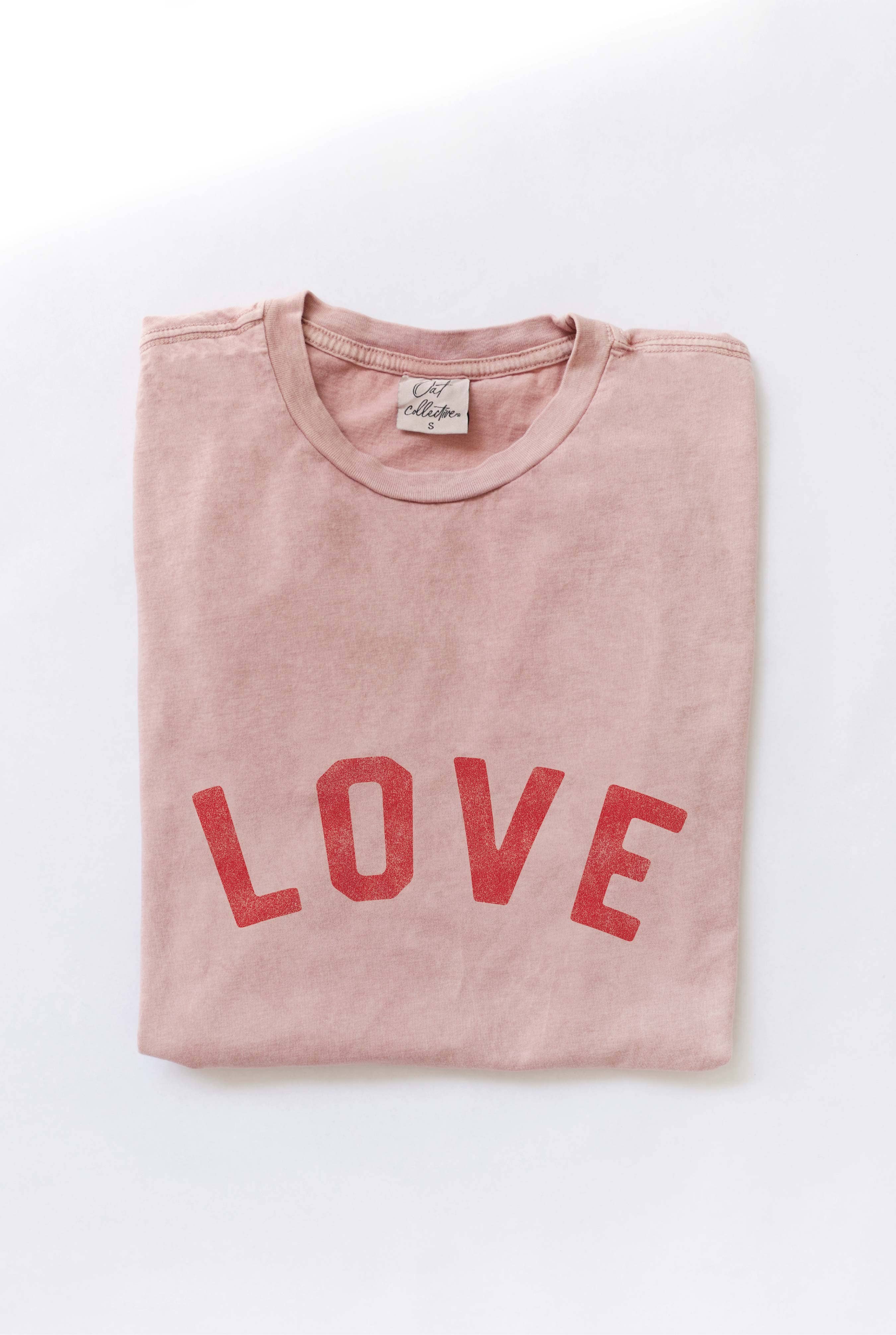 Ivory "LOVE" graphic t-shirt with bold red vintage-style lettering, made from soft cotton for a relaxed and comfortable fit.