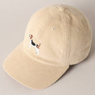 Beige corduroy baseball cap with embroidered beagle dog design on the front.