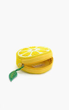 Round beaded lemon slice crossbody bag with silver chain strap and green leaf charm accent.