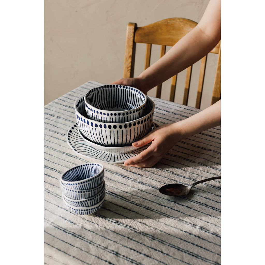 Sprout Stamped Plate with intricate blue radial patterns and an organic shape, ideal for serving and display.