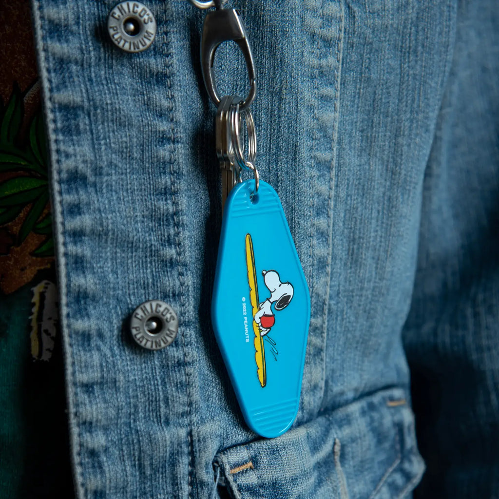 Peanuts Snoopy Surf Key Tag - Snoopy catching a surf, a durable and charming key accessory for surf enthusiasts.